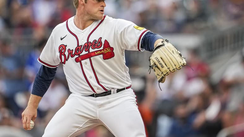 Aug 22, 2023; Cumberland, Georgia, USA; Atlanta Braves starting pitcher Bryce Elder (55) pitches against the New York Mets during the first inning at Truist Park. Mandatory Credit: Dale Zanine-USA TODAY Sports