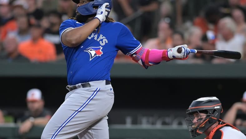 Aug 22, 2023; Baltimore, Maryland, USA; Toronto Blue Jays first baseman Vladimir Guerrero Jr. (27) singles to center field during the third inning against the Baltimore Orioles at Oriole Park at Camden Yards. Mandatory Credit: Tommy Gilligan-USA TODAY Sports