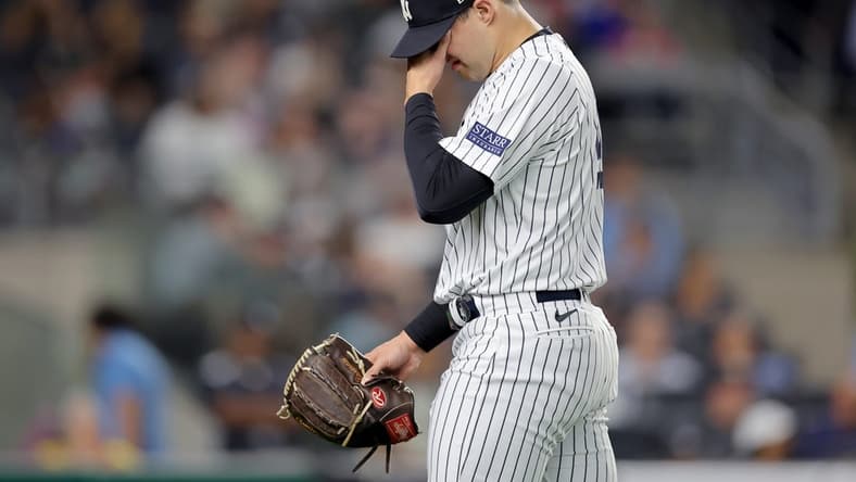 Aug 22, 2023; Bronx, New York, USA; New York Yankees relief pitcher Tommy Kahnle (41) reacts during the eighth inning against the Washington Nationals at Yankee Stadium. Mandatory Credit: Brad Penner-USA TODAY Sports
