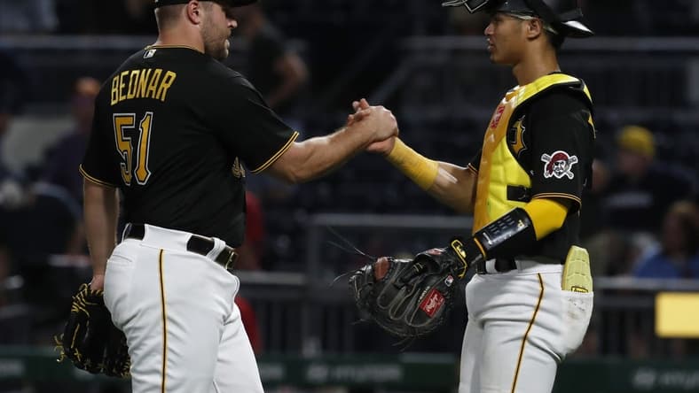 Aug 22, 2023; Pittsburgh, Pennsylvania, USA; Pittsburgh Pirates relief pitcher David Bednar (51) and catcher Endy Rodriguez (25) celebrate after defeating the St. Louis Cardinals at PNC Park. The Pirates won 6-3. Mandatory Credit: Charles LeClaire-USA TODAY Sports