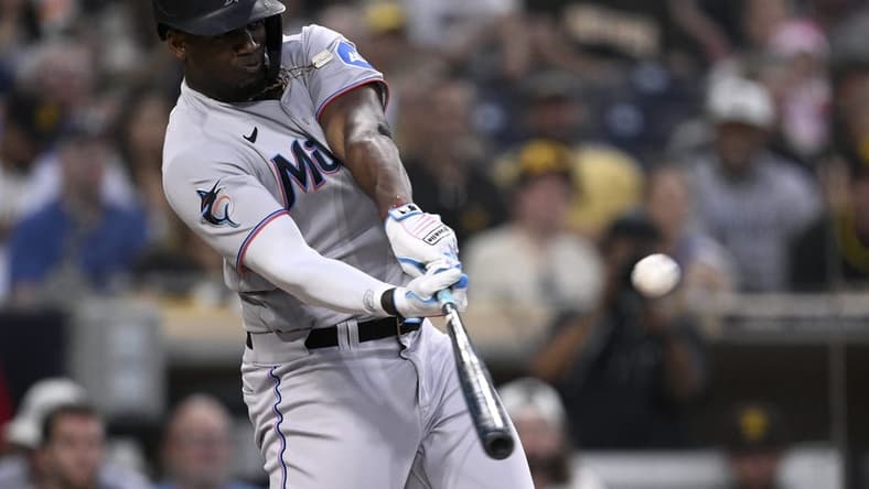 Aug 22, 2023; San Diego, California, USA; Miami Marlins designated hitter Jorge Soler (12) hits a home run against the San Diego Padres during the third inning at Petco Park. Mandatory Credit: Orlando Ramirez-USA TODAY Sports