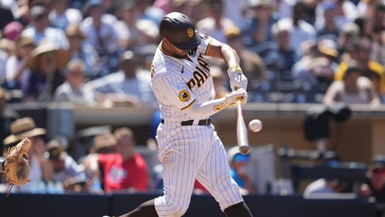 Aug 23, 2023; San Diego, California, USA; San Diego Padres shortstop Xander Bogaerts (2) hits a two run home run against the Miami Marlins during the sixth inning at Petco Park. Mandatory Credit: Ray Acevedo-USA TODAY Sports