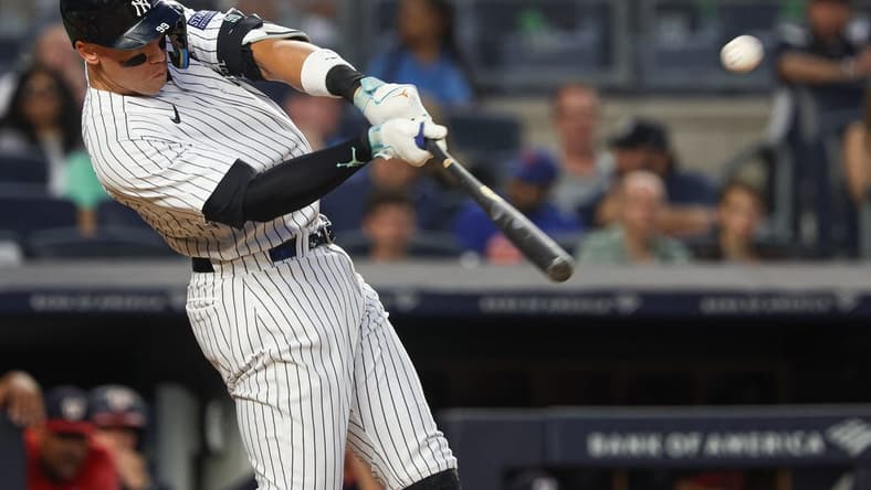 Aug 23, 2023; Bronx, New York, USA; New York Yankees right fielder Aaron Judge (99) hits a grand slam home run during the second inning against the Washington Nationals at Yankee Stadium. Mandatory Credit: Vincent Carchietta-USA TODAY Sports