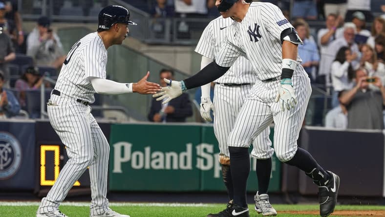 Aug 23, 2023; Bronx, New York, USA; New York Yankees right fielder Aaron Judge (99) celebrates his grand slam home run with center fielder Everson Pereira (80) during the second inning against the Washington Nationals at Yankee Stadium. Mandatory Credit: Vincent Carchietta-USA TODAY Sports
