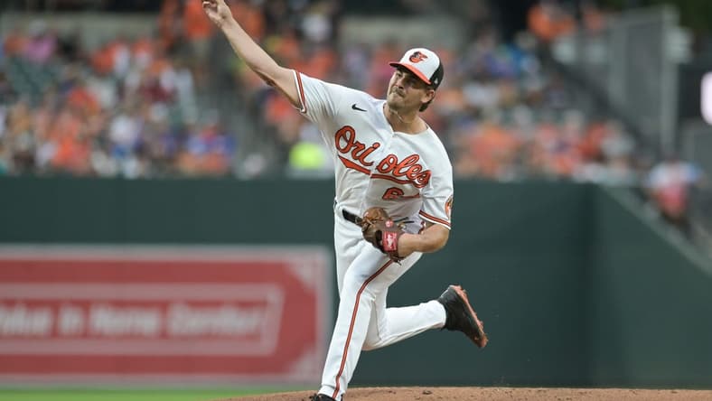 Aug 23, 2023; Baltimore, Maryland, USA;  Baltimore Orioles starting pitcher Dean Kremer (64) throws a first inning pitch against the Toronto Blue Jays at Oriole Park at Camden Yards. Mandatory Credit: Tommy Gilligan-USA TODAY Sports