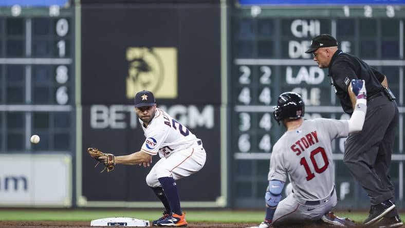 Aug 23, 2023; Houston, Texas, USA; Boston Red Sox shortstop Trevor Story (10) is safe at second base with a double as Houston Astros second baseman Jose Altuve (27) attempts to field a throw during the second inning at Minute Maid Park. Mandatory Credit: Troy Taormina-USA TODAY Sports