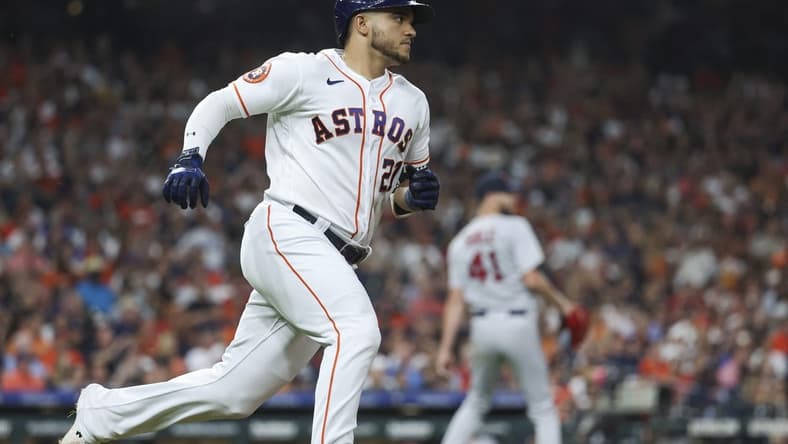 Aug 23, 2023; Houston, Texas, USA; Boston Red Sox starting pitcher Chris Sale (41) reacts and Houston Astros designated hitter Yainer Diaz (21) runs to first base after hitting a single during the third inning at Minute Maid Park. Mandatory Credit: Troy Taormina-USA TODAY Sports