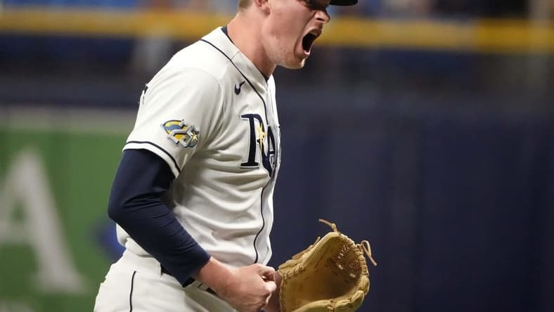 Aug 23, 2023; St. Petersburg, Florida, USA; Tampa Bay Rays relief pitcher Pete Fairbanks (29) celebrates after ending the tenth inning with a strikeout against the Colorado Rockies at Tropicana Field. Mandatory Credit: Dave Nelson-USA TODAY Sports
