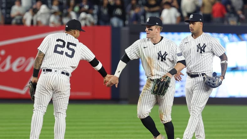 Aug 23, 2023; Bronx, New York, USA; New York Yankees center fielder Harrison Bader (22) celebrates with second baseman Gleyber Torres (25) and center fielder Everson Pereira (80) after defeating the Washington Nationals at Yankee Stadium. Mandatory Credit: Vincent Carchietta-USA TODAY Sports