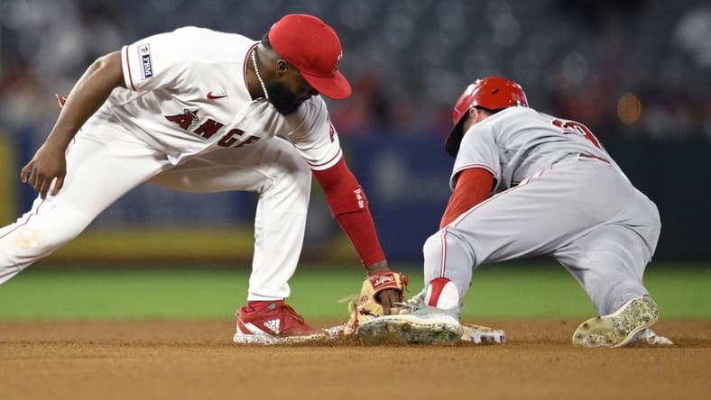 Aug 23, 2023; Anaheim, California, USA; Cincinnati Reds center fielder TJ Friedl (29) steals second base ahead of the tag by Los Angeles Angels second baseman Luis Rengifo (2) during the fifth inning at Angel Stadium. Mandatory Credit: Orlando Ramirez-USA TODAY Sports