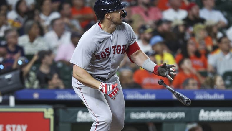 Aug 23, 2023; Houston, Texas, USA; Boston Red Sox center fielder Adam Duvall (18) hits a three-run home run during the tenth inning against the Houston Astros at Minute Maid Park. Mandatory Credit: Troy Taormina-USA TODAY Sports