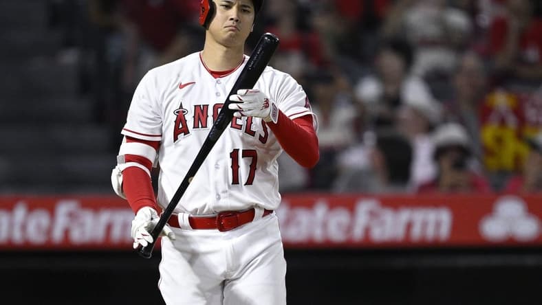 Aug 23, 2023; Anaheim, California, USA; Los Angeles Angels designated hitter Shohei Ohtani (17) looks at his bat during the ninth inning against the Cincinnati Reds at Angel Stadium. Mandatory Credit: Orlando Ramirez-USA TODAY Sports