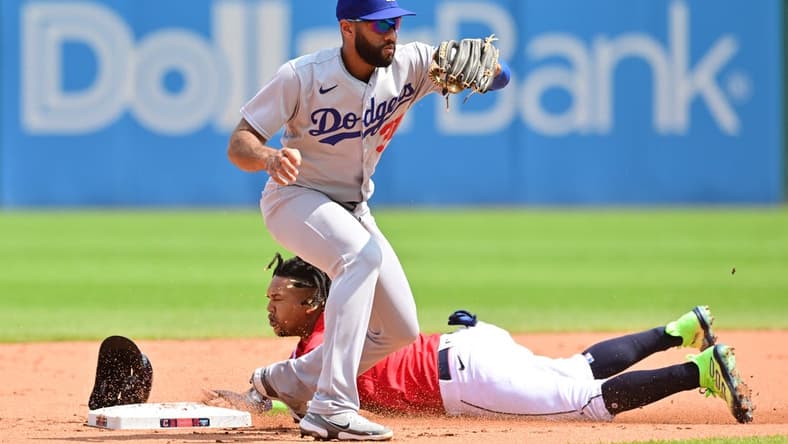 Aug 24, 2023; Cleveland, OH, USA; Cleveland Guardians third baseman Jose Ramirez (11) steals second as Los Angeles Dodgers second baseman Amed Rosario (31) catches the throw during the third inning at Progressive Field. Mandatory Credit: Ken Blaze-USA TODAY Sports
