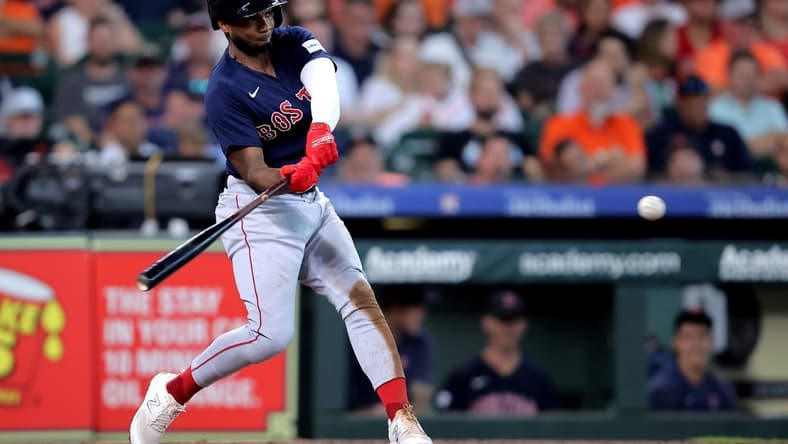 Aug 24, 2023; Houston, Texas, USA; Boston Red Sox shortstop Pablo Reyes (19) hits an RBI single against the Houston Astros during the third inning at Minute Maid Park. Mandatory Credit: Erik Williams-USA TODAY Sports