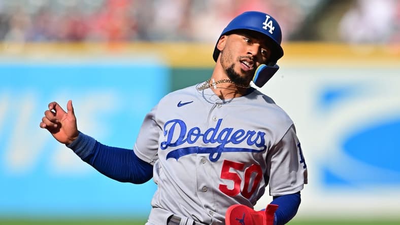 Aug 24, 2023; Cleveland, Ohio, USA; Los Angeles Dodgers right fielder Mookie Betts (50) advances to third on double hit by first baseman Freddie Freeman (5) during the third inning against the Cleveland Guardians at Progressive Field. Mandatory Credit: Ken Blaze-USA TODAY Sports