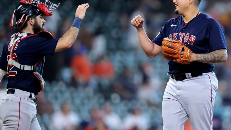 Aug 24, 2023; Houston, Texas, USA; Boston Red Sox catcher Connor Wong (12) congratulates Boston Red Sox relief pitcher Mauricio Llovera (68) following the final out against the Houston Astros during the ninth inning at Minute Maid Park. Mandatory Credit: Erik Williams-USA TODAY Sports