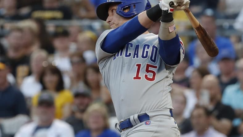 Aug 24, 2023; Pittsburgh, Pennsylvania, USA; Chicago Cubs catcher Yan Gomes (15) hits a single against the Pittsburgh Pirates/ during the second inning at PNC Park. Mandatory Credit: Charles LeClaire-USA TODAY Sports