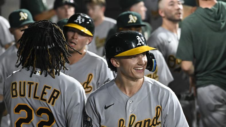 Aug 24, 2023; Chicago, Illinois, USA; Oakland Athletics second baseman Zack Gelof (20) celebrates in the dugout after he hits a two run home run against the Chicago White Sox during the seventh inning at Guaranteed Rate Field. Mandatory Credit: Matt Marton-USA TODAY Sports
