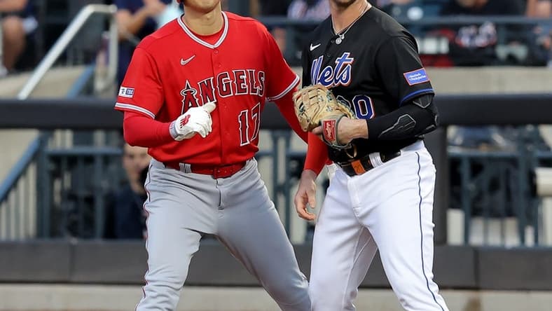 Aug 25, 2023; New York City, New York, USA; Los Angeles Angels designated hitter Shohei Ohtani (17) takes a lead off first base against New York Mets first baseman Pete Alonso (20) after walking during the first inning at Citi Field. Mandatory Credit: Brad Penner-USA TODAY Sports