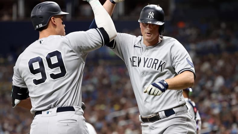 Aug 25, 2023; St. Petersburg, Florida, USA; New York Yankees third baseman DJ LeMahieu (26) celebrates with right fielder Aaron Judge (99) after he hit a home run against the Tampa Bay Rays during the fifth inning at Tropicana Field. Mandatory Credit: Kim Klement Neitzel-USA TODAY Sports