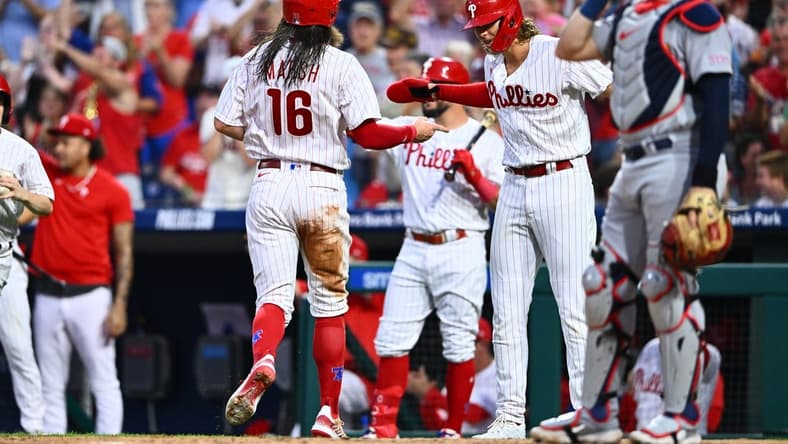 Aug 25, 2023; Philadelphia, Pennsylvania, USA; Philadelphia Phillies outfielder Brandon Marsh (16) celebrates with infielder Alec Bohm (28) after scoring against the St. Louis Cardinals in the second inning at Citizens Bank Park. Mandatory Credit: Kyle Ross-USA TODAY Sports