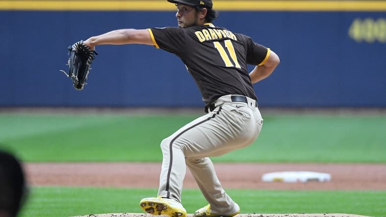 Aug 25, 2023; Milwaukee, Wisconsin, USA; San Diego Padres starting pitcher Yu Darvish (11) delivers a pitch against the Milwaukee Brewers in the first inning at American Family Field. Mandatory Credit: Michael McLoone-USA TODAY Sports