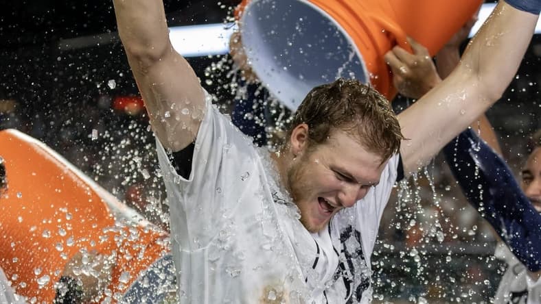 Aug 26, 2023; Detroit, Michigan, USA; Detroit Tigers center fielder Parker Meadows (22) gets showered with water after hitting a walk off three run home run to defeat the Houston Astros in the ninth inning at Comerica Park. Mandatory Credit: David Reginek-USA TODAY Sports