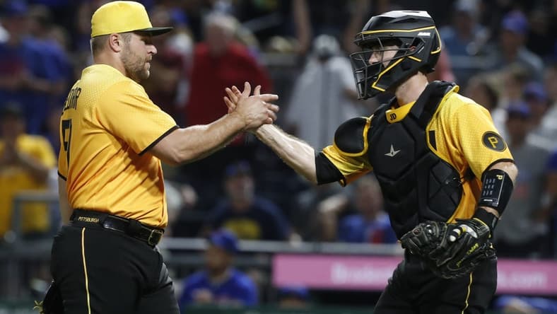 Aug 25, 2023; Pittsburgh, Pennsylvania, USA; Pittsburgh Pirates relief pitcher David Bednar (51) and catcher Jason Delay (55) shake hands after defeating the Chicago Cubs at PNC Park. Pittsburgh won 2-1. Mandatory Credit: Charles LeClaire-USA TODAY Sports