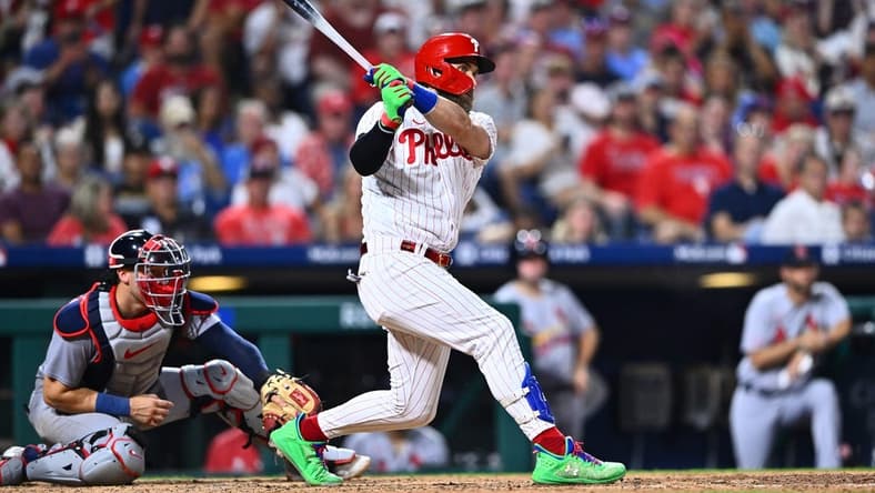 Aug 25, 2023; Philadelphia, Pennsylvania, USA; Philadelphia Phillies first baseman Bryce Harper (3) hits a triple against the St. Louis Cardinals in the seventh inning at Citizens Bank Park. Mandatory Credit: Kyle Ross-USA TODAY Sports