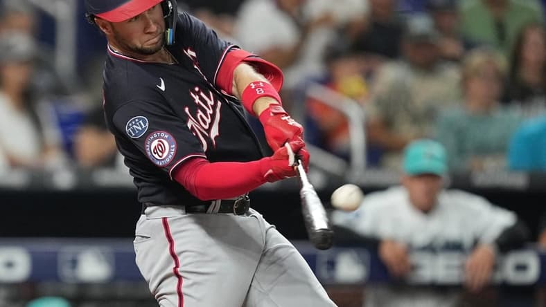 Aug 25, 2023; Miami, Florida, USA; Washington Nationals third baseman Carter Kieboom (8) hits a two-run home run against the Miami Marlins in the sixth inning at loanDepot Park. Mandatory Credit: Jim Rassol-USA TODAY Sports