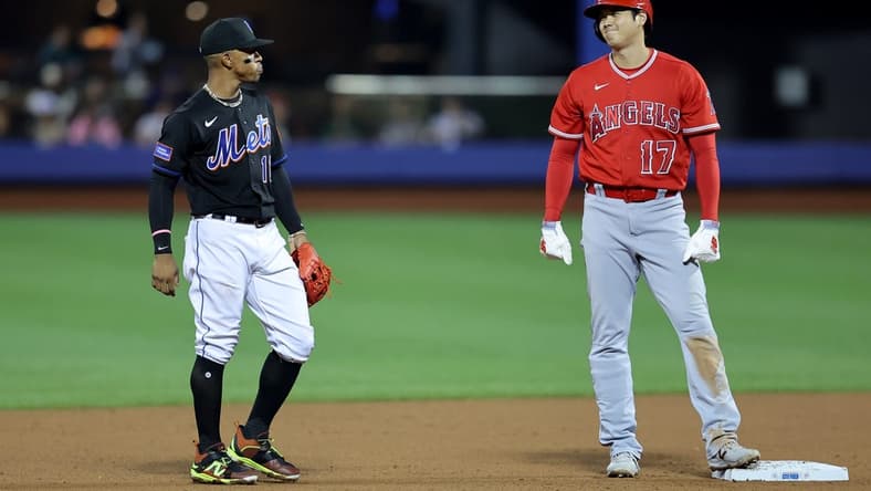 Aug 25, 2023; New York City, New York, USA; Los Angeles Angels designated hitter Shohei Ohtani (17) talks to New York Mets shortstop Francisco Lindor (12) at second base during the fifth inning at Citi Field. Mandatory Credit: Brad Penner-USA TODAY Sports