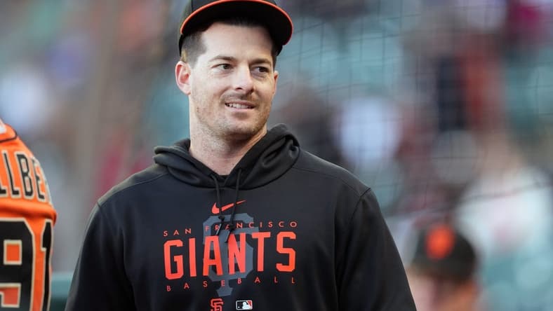 Aug 25, 2023; San Francisco, California, USA; San Francisco Giants outfielder Mike Yastrzemski stands in the dugout before the game against the Atlanta Braves at Oracle Park. Mandatory Credit: Darren Yamashita-USA TODAY Sports