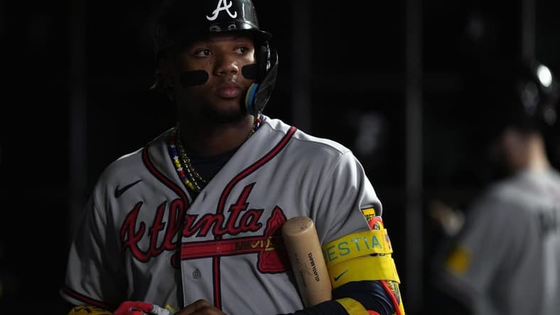 Aug 25, 2023; San Francisco, California, USA; Atlanta Braves right fielder Ronald Acuna Jr. (13) stands in the dugout during the fifth inning against the San Francisco Giants at Oracle Park. Mandatory Credit: Darren Yamashita-USA TODAY Sports