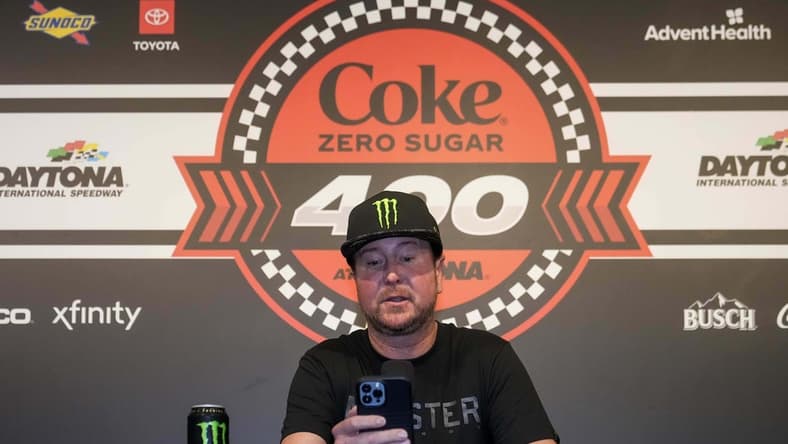Aug 26, 2023; Daytona Beach, Florida, USA; Kurt Busch reads from a prepared statement announcing his retirement prior to the Coke Zero Sugar 400 at Daytona International Speedway. Mandatory Credit: David Yeazell-USA TODAY Sports