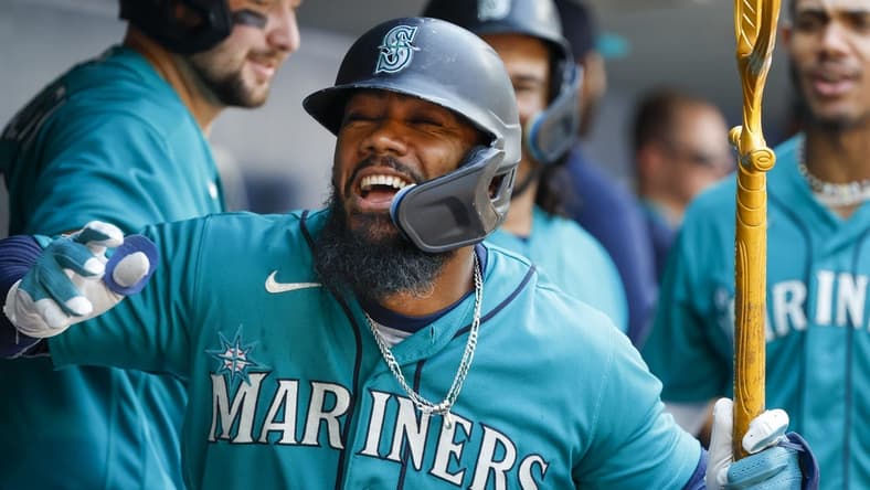 Aug 28, 2023; Seattle, Washington, USA; Seattle Mariners right fielder Teoscar Hernandez (35) celebrates in the dugout after hitting a grand slam home run against the Kansas City Royals during the third inning at T-Mobile Park. Mandatory Credit: Joe Nicholson-USA TODAY Sports