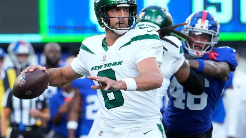 Aug 26, 2023; East Rutherford, New Jersey, USA; New York Jets quarterback Aaron Rodgers (8) throws against the Giants at MetLife Stadium. Mandatory Credit: Robert Deutsch-USA TODAY Sports