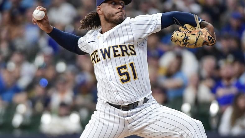 Aug 26, 2023; Milwaukee, Wisconsin, USA; Milwaukee Brewers pitcher Freddy Peralta (51) pitches against the San Diego Padres in the first inning at American Family Field. Mandatory Credit: Benny Sieu-USA TODAY Sports