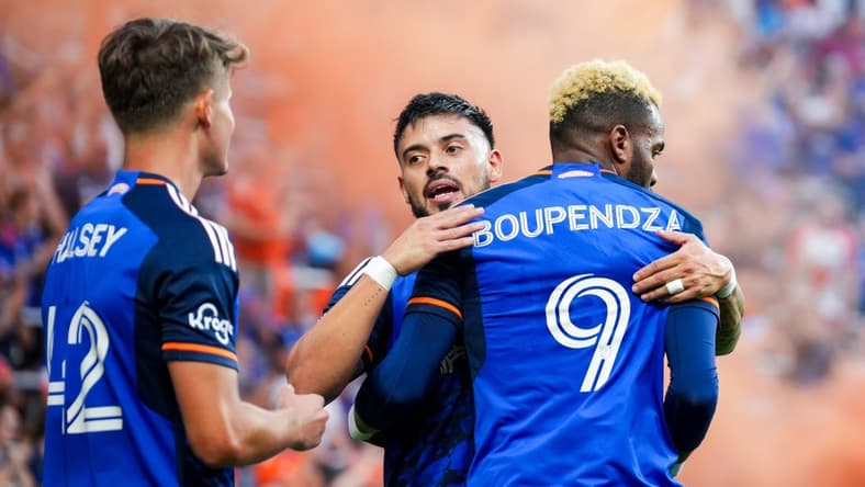 Aug 26, 2023; Cincinnati, Ohio, USA; FC Cincinnati forward Aaron Boupendza (9) celebrates with midfielder Junior Moreno (93) after scoring a goal against New York City FC in the first half at TQL Stadium. Mandatory Credit: Aaron Doster-USA TODAY Sports
