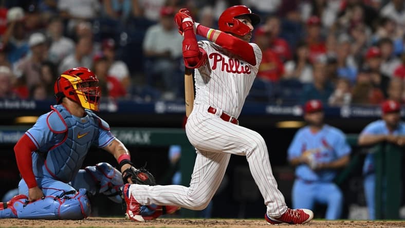 Aug 26, 2023; Philadelphia, Pennsylvania, USA;  Philadelphia Phillies second baseman Bryson Stott (5) hits a solo home run to center field during the fourth inning against the St. Louis Cardinals at Citizens Bank Park. Mandatory Credit: John Geliebter-USA TODAY Sports