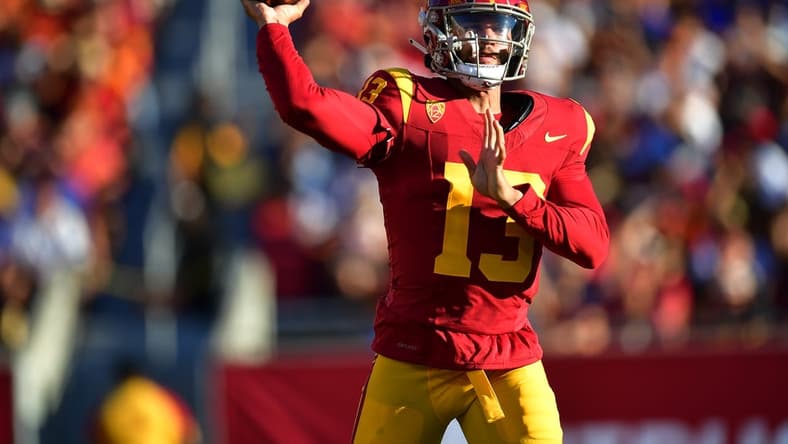 Aug 26, 2023; Los Angeles, California, USA; Southern California Trojans quarterback Caleb Williams (13) throws against the San Jose State Spartans during the first half at Los Angeles Memorial Coliseum. Mandatory Credit: Gary A. Vasquez-USA TODAY Sports