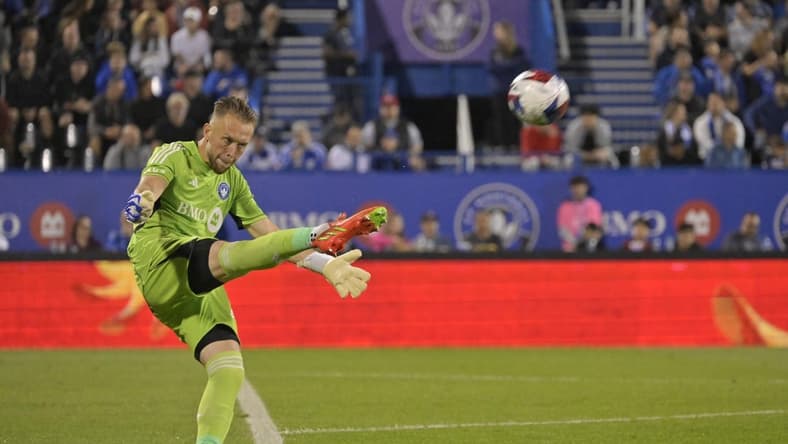 Aug 26, 2023; Montreal, Quebec, CAN; CF Montreal goalkeeper Jonathan Sirois (40) punts the ball against the New England Revolution during the second half at Stade Saputo. Mandatory Credit: Eric Bolte-USA TODAY Sports