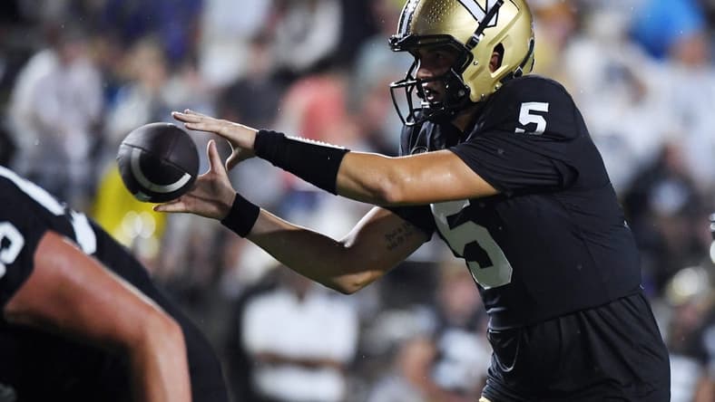 Aug 26, 2023; Nashville, Tennessee, USA; Vanderbilt Commodores quarterback AJ Swann (5) takes the snap during the first half against the Hawaii Warriors at FirstBank Stadium. Mandatory Credit: Christopher Hanewinckel-USA TODAY Sports