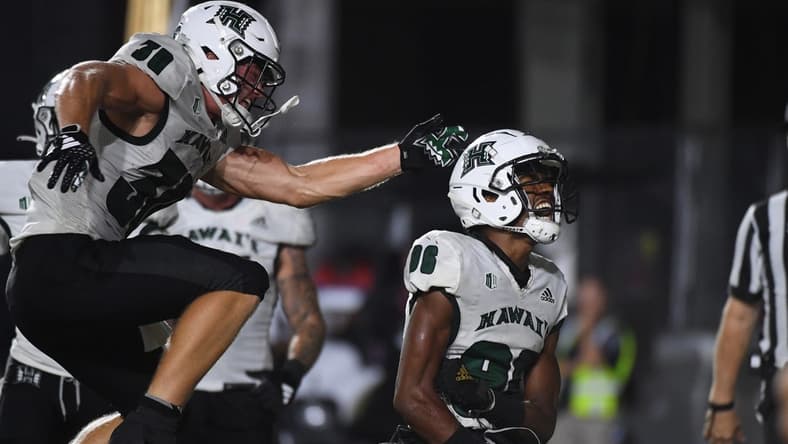 Aug 26, 2023; Nashville, Tennessee, USA; Hawaii Warriors wide receiver Pofele Ashlock (86) celebrates with running back Landon Sims (30) after a touchdown during the second half against the Vanderbilt Commodores at FirstBank Stadium. Mandatory Credit: Christopher Hanewinckel-USA TODAY Sports