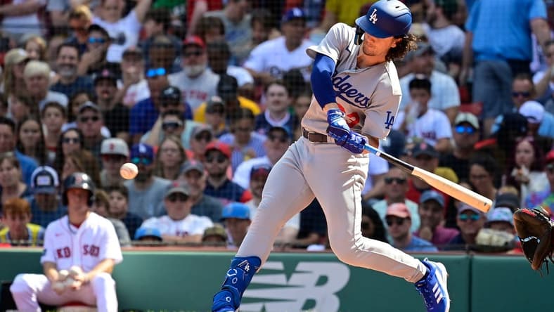 Aug 27, 2023; Boston, Massachusetts, USA; Los Angeles Dodgers center fielder James Outman (33) hits a home run during the fourth inning against the Boston Red Sox at Fenway Park. Mandatory Credit: Eric Canha-USA TODAY Sports
