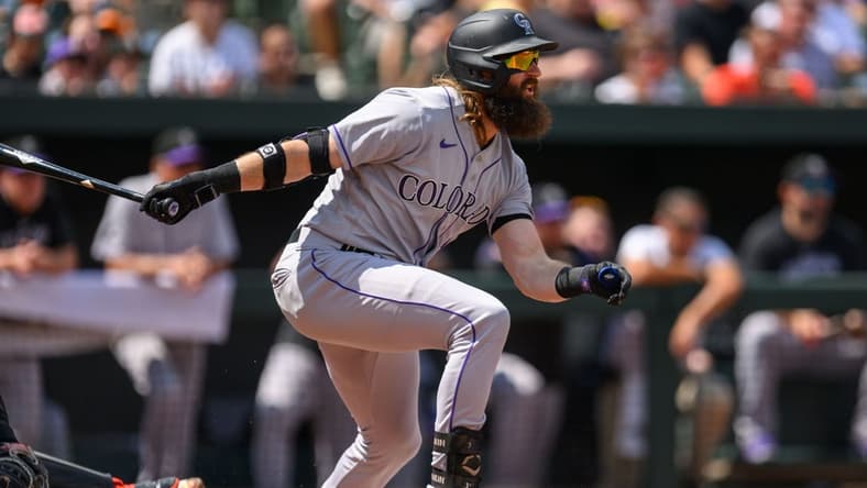 Aug 27, 2023; Baltimore, Maryland, USA; Colorado Rockies designated hitter Charlie Blackmon (19) hits a single during the first inning against the Baltimore Orioles at Oriole Park at Camden Yards. Mandatory Credit: Reggie Hildred-USA TODAY Sports