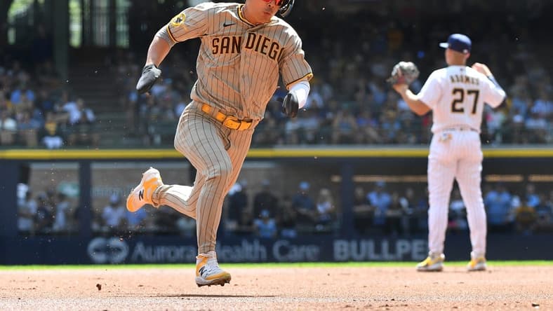 Aug 27, 2023; Milwaukee, Wisconsin, USA; San Diego Padres second baseman Ha-Seong Kim (7) runs from first to third base against the Milwaukee Brewers in the first inning at American Family Field. Mandatory Credit: Michael McLoone-USA TODAY Sports