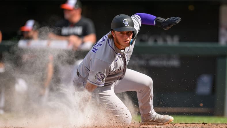 Aug 27, 2023; Baltimore, Maryland, USA; Colorado Rockies first baseman Hunter Goodman (15) scores a run during the ninth inning against the Baltimore Orioles at Oriole Park at Camden Yards. Mandatory Credit: Reggie Hildred-USA TODAY Sports