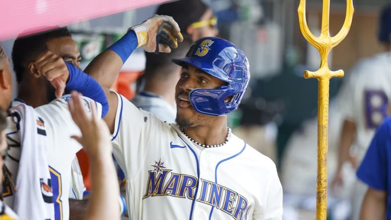 Aug 27, 2023; Seattle, Washington, USA; Seattle Mariners center fielder Julio Rodriguez (44) celebrates in the dugout after hitting a two-run home run against the Kansas City Royals during the fifth inning at T-Mobile Park. Mandatory Credit: Joe Nicholson-USA TODAY Sports