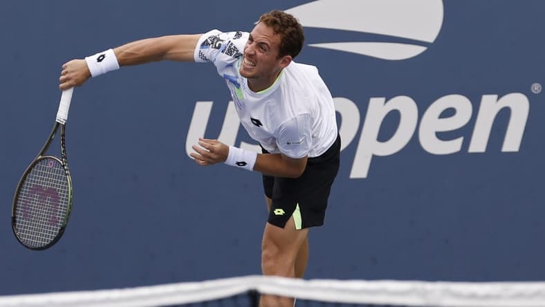 Aug 28, 2023; Flushing, NY, USA; Roberto Carballes Baena of Spain serves against Hulger Rune of Denmark (not pictured) on day one of the 2023 US Open at the Billie Jean King National Tennis Center. Mandatory Credit: Geoff Burke-USA TODAY Sports