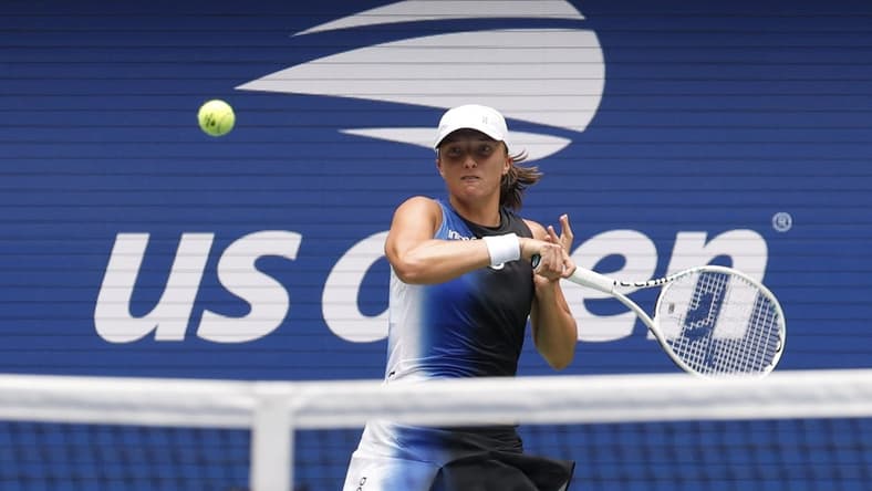 Aug 28, 2023; Flushing, NY, USA; Iga Swiatek of Poland hits a forehand against Rebecca Peterson of Sweden (not pictured) on day one of the 2023 US Open at the Billie Jean King National Tennis Center. Mandatory Credit: Geoff Burke-USA TODAY Sports